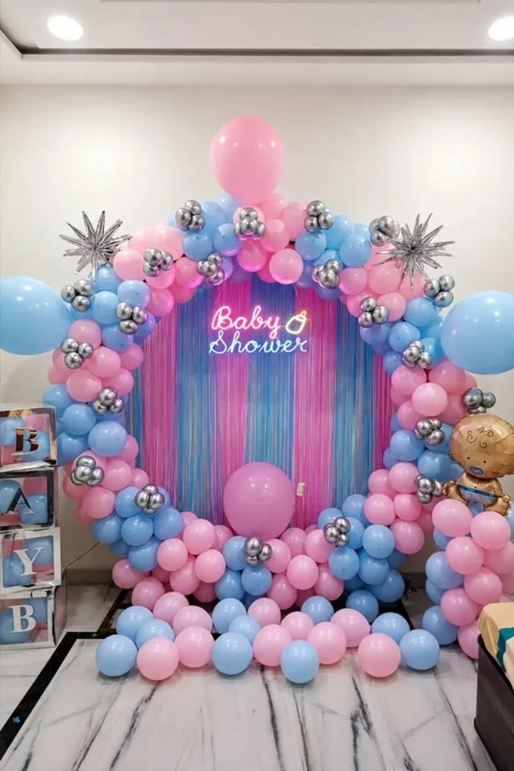 Pink and blue baby shower balloon ring decoration